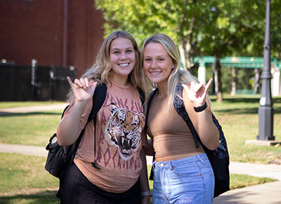 two students outside on campus during first day of class